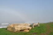 Narragansett foggy shore with rock and bench